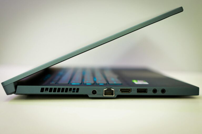 Close-up of a sleek laptop featuring various ports and a slim design.